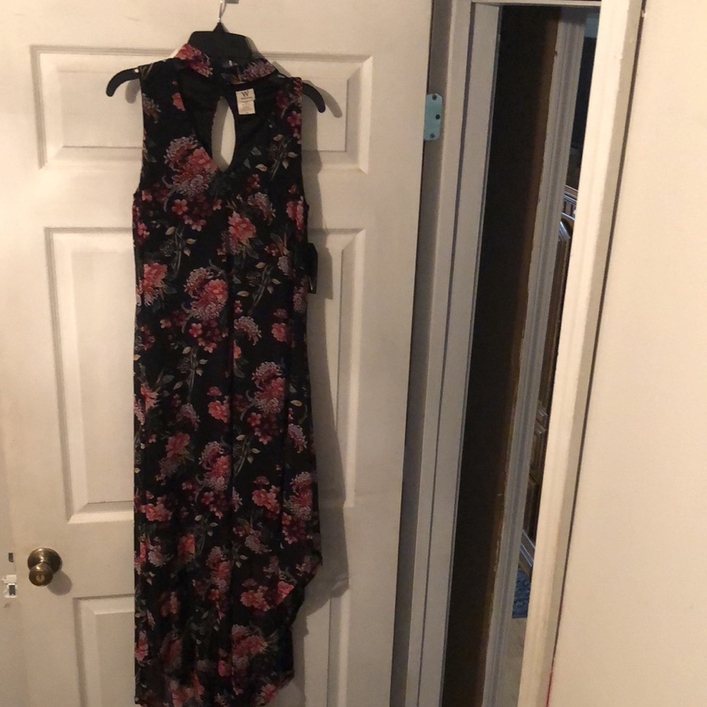 Black with floral pattern Dress with neck strap.